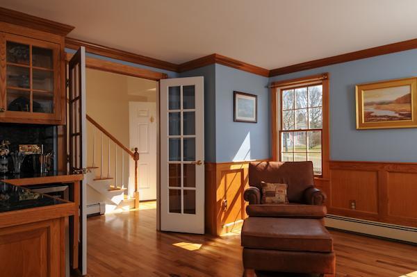 141 Elliott Road Centerville, MA 02632 - Photo 12 of 17 a living room with furniture a lamp wooden floor and a window