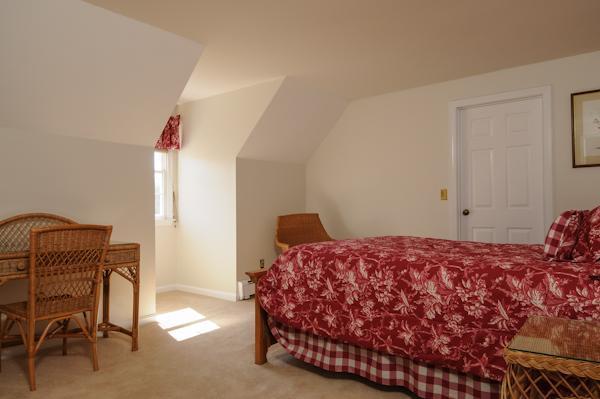 141 Elliott Road Centerville, MA 02632 - Photo 16 of 17 a bedroom with a bed and a chair in it