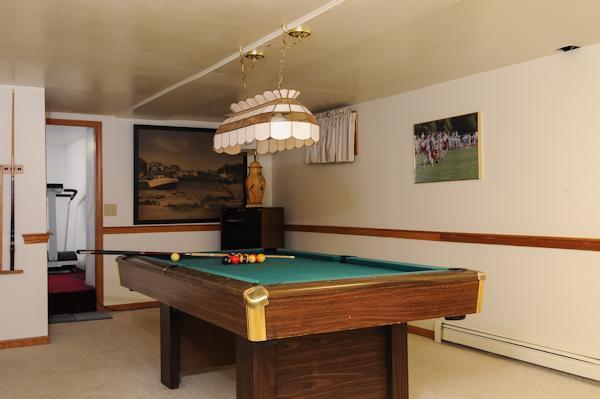 141 Elliott Road Centerville, MA 02632 - Photo 17 of 17 a room with pool table and chandelier