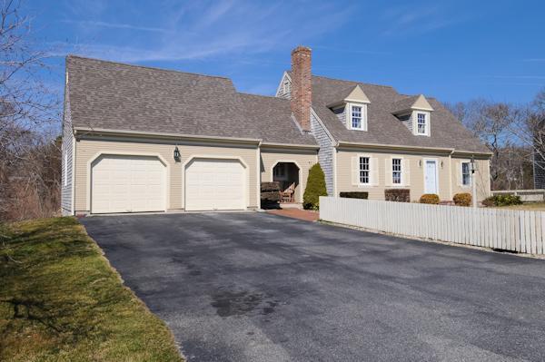 141 Elliott Road Centerville, MA 02632 - Photo 2 of 17 a front view of a house with a yard