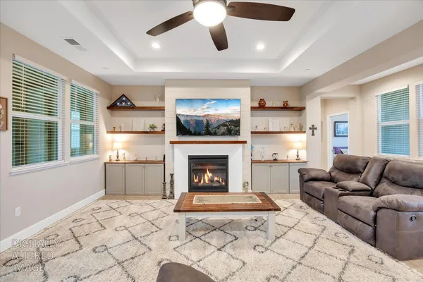 a view of a livingroom with furniture and windows