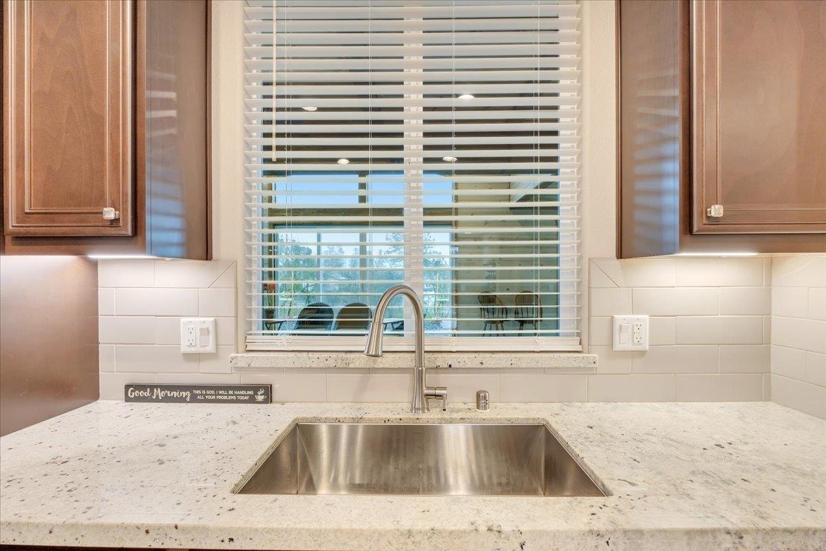 133 Palisades Place Copperopolis, CA 95228 - Photo 20 of 89 a view of a sink and a window