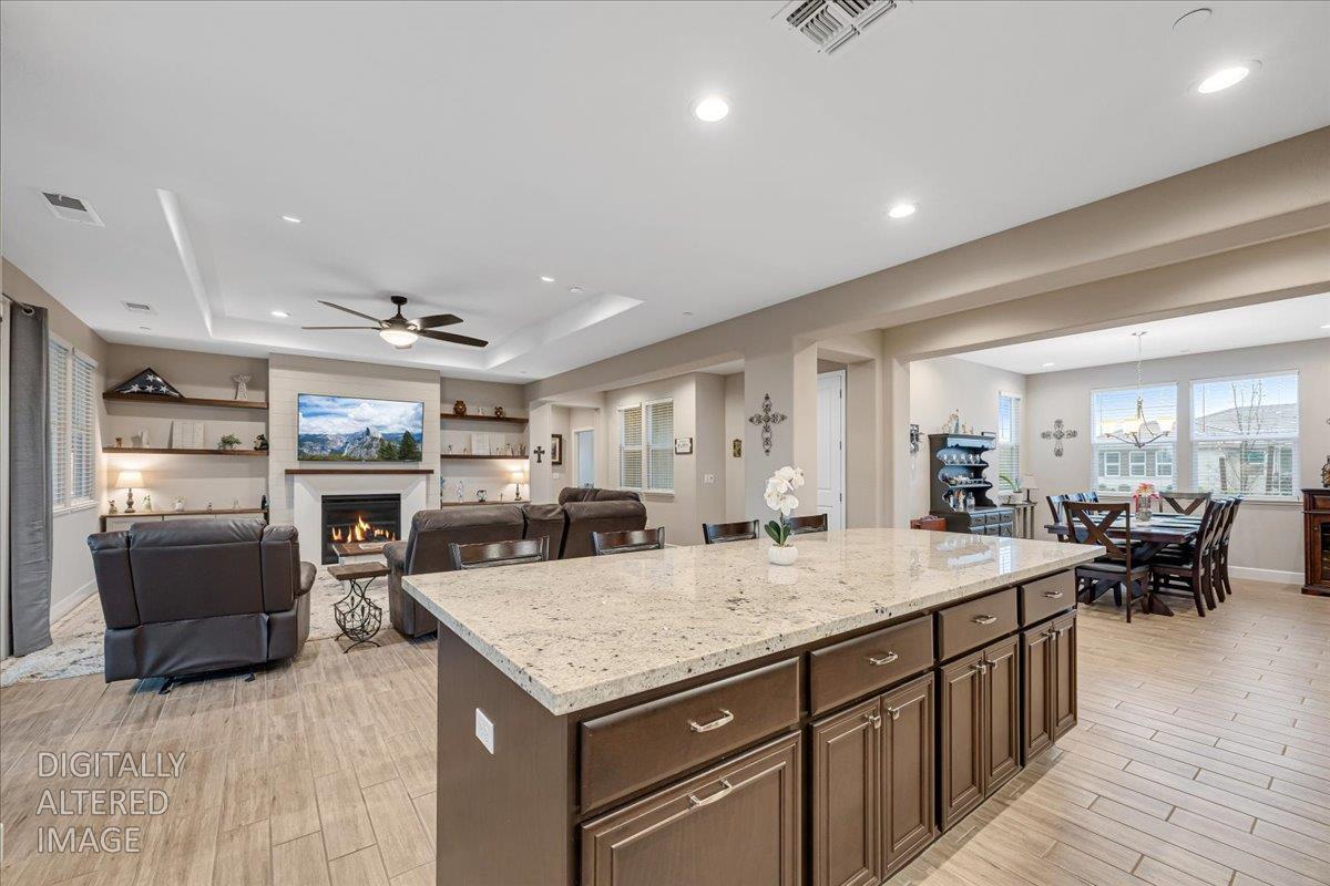 133 Palisades Place Copperopolis, CA 95228 - Photo 21 of 89 a kitchen with granite countertop a counter space dining table and stainless steel appliances