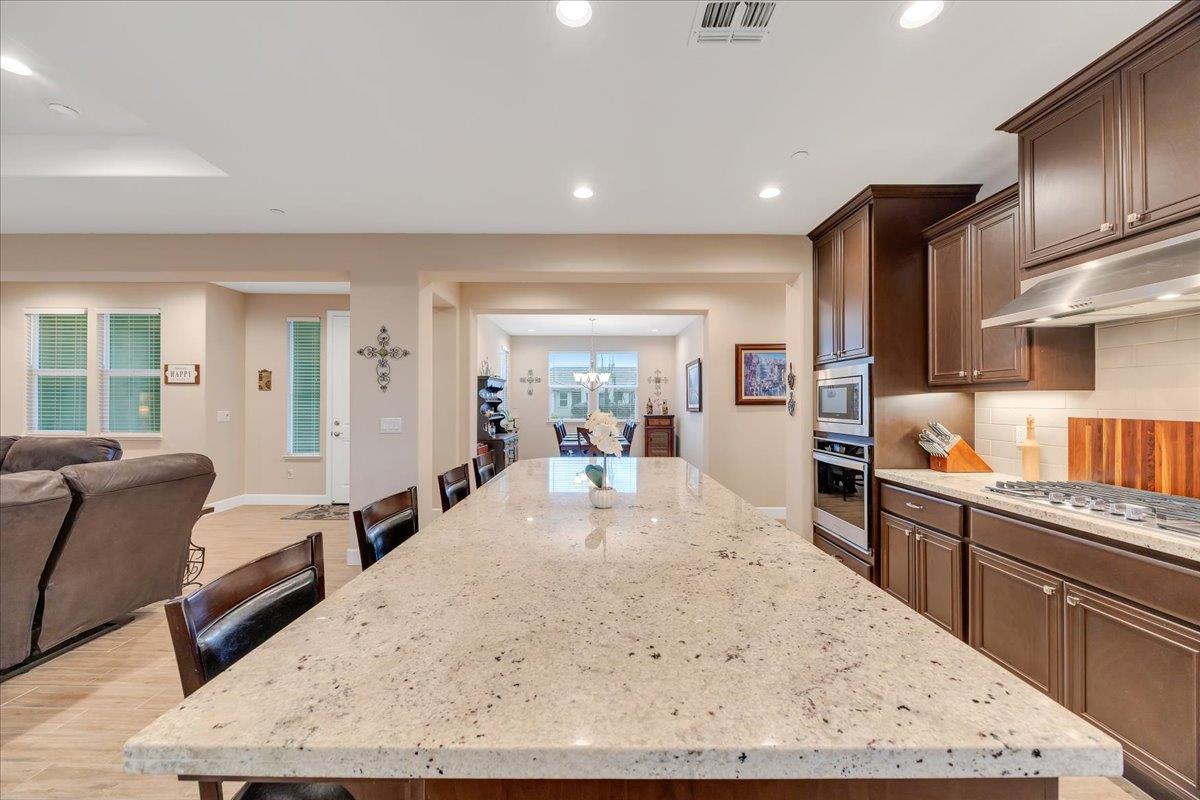 133 Palisades Place Copperopolis, CA 95228 - Photo 22 of 89 a large white kitchen with stainless steel appliances granite countertop lots of counter top space