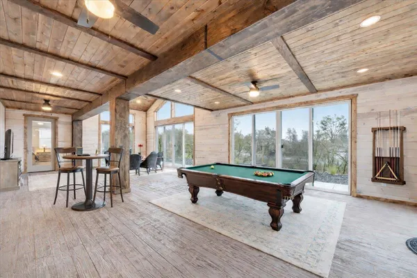 a dining room with furniture and wooden floor