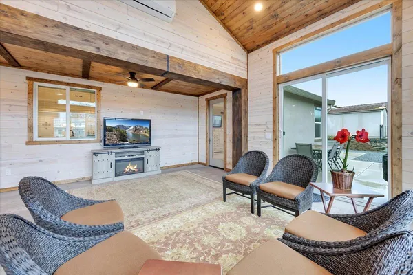 a bedroom with a bed chair and a window