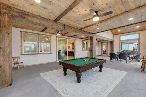 a view of walk in closet with clothes