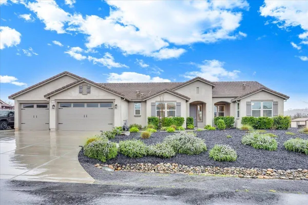 an aerial view of a house with a swimming pool