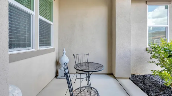 a living room with furniture ceiling fan and a rug