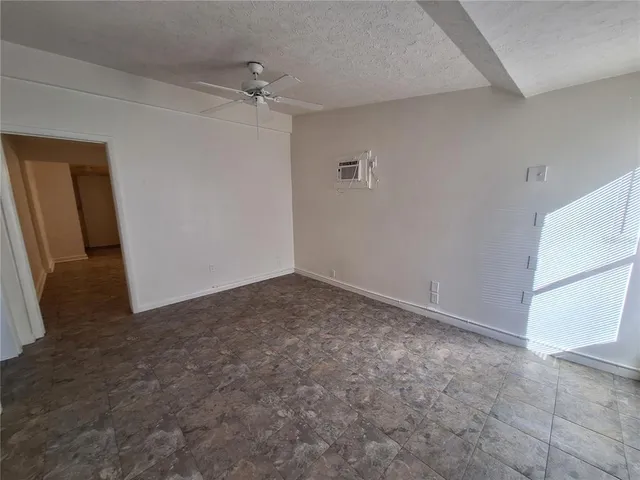 an empty room with a bathroom