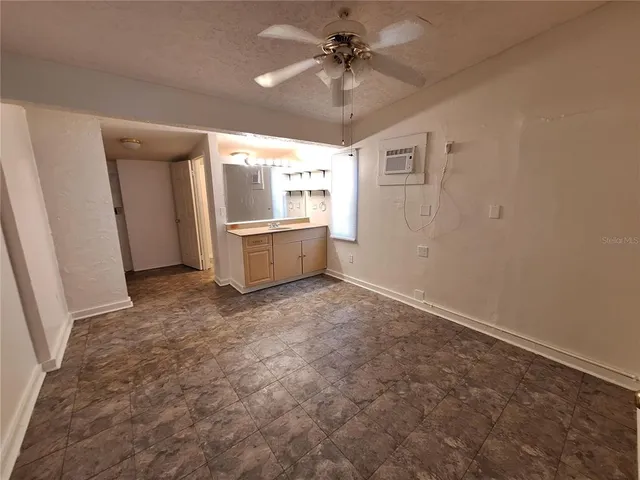 a view of a kitchen with a sink and a window