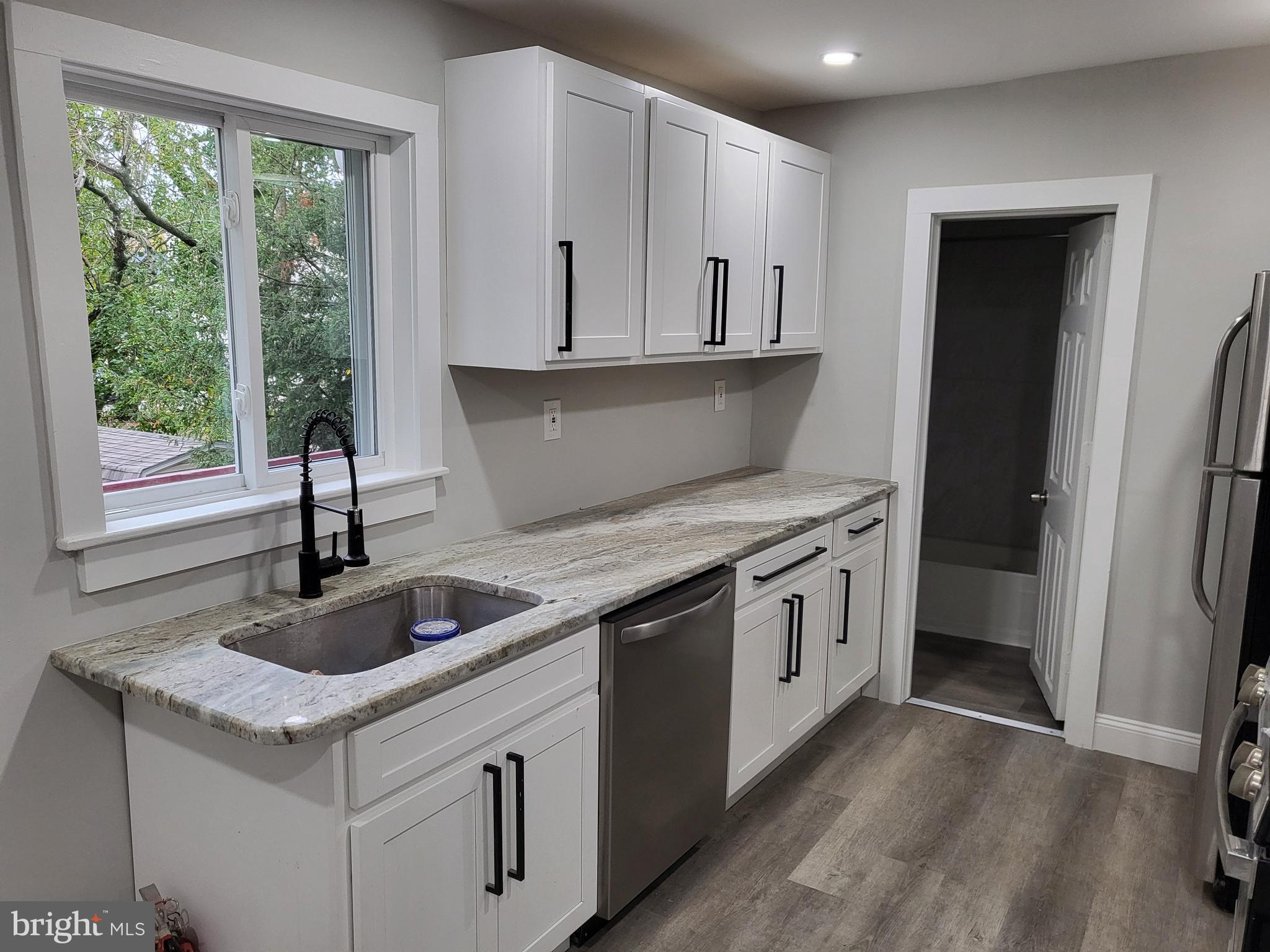 212 Warren Street, Unit 3 Beverly, NJ 08010 - Photo 1 of 18 New Kitchen with Granite, Stainless Steel