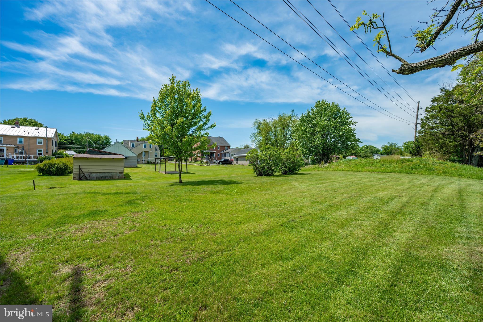 11205 Hessong Bridge Road Thurmont, MD 21788 - Photo 66 of 69 a view of a garden with a building in the background