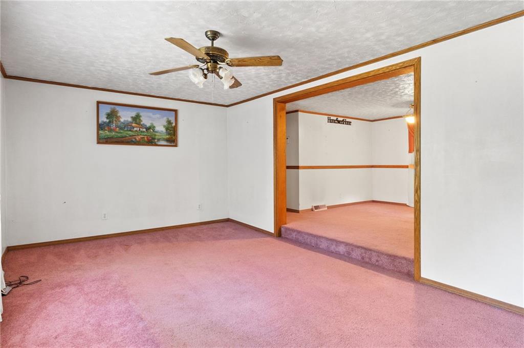 194 Conner School Road Wampum, PA 16157 - Photo 15 of 25 an empty room with a ceiling fan and window