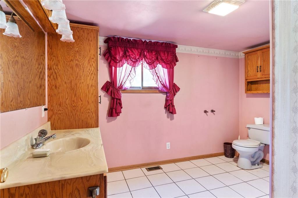 194 Conner School Road Wampum, PA 16157 - Photo 20 of 25 a bathroom with a sink toilet and shower