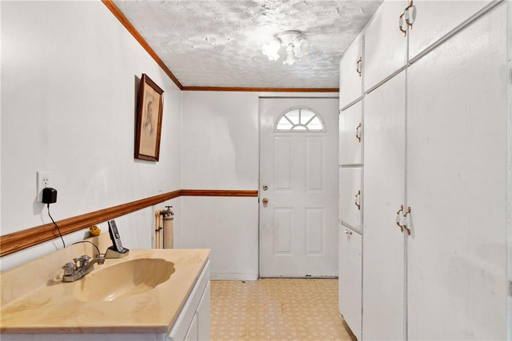 194 Conner School Road Wampum, PA 16157 - Photo 21 of 25 a bathroom with a sink and a mirror