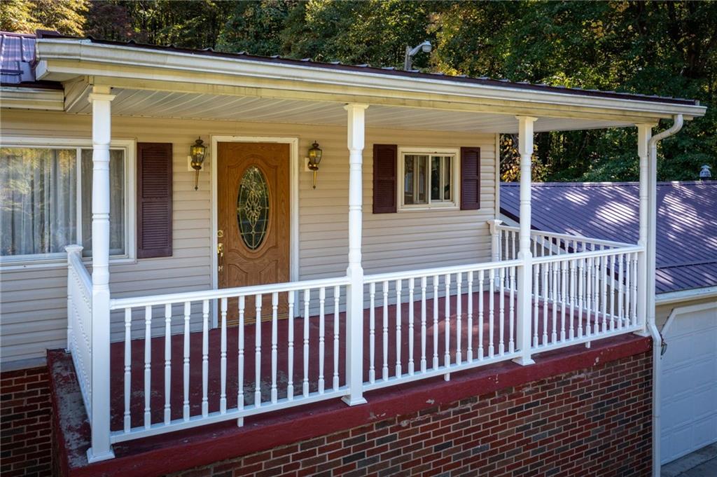 194 Conner School Road Wampum, PA 16157 - Photo 7 of 25 a view of a house with a wooden deck