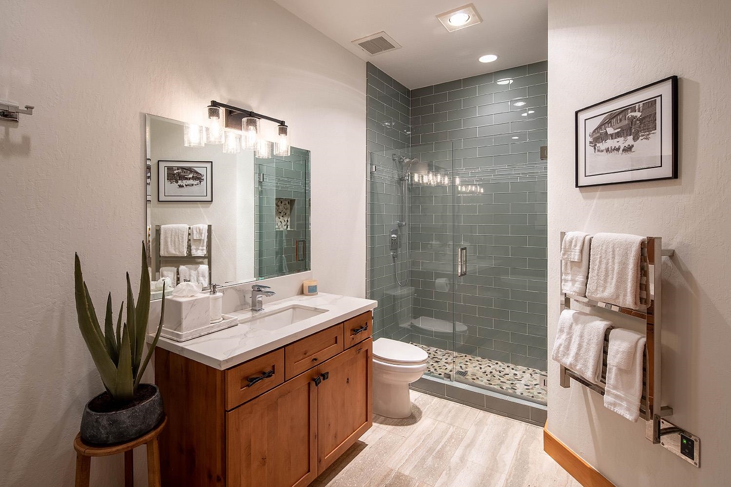 135 Alpine Meadows Road, Unit 33 Alpine Meadows, CA 96145 - Photo 14 of 21 a bathroom with a sink a toilet and shower