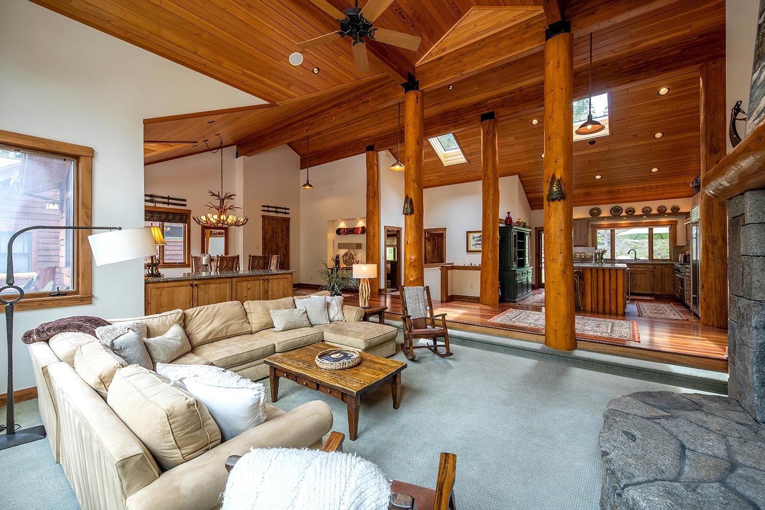 135 Alpine Meadows Road, Unit 33 Alpine Meadows, CA 96145 - Photo 5 of 21 a living room with furniture and a chandelier