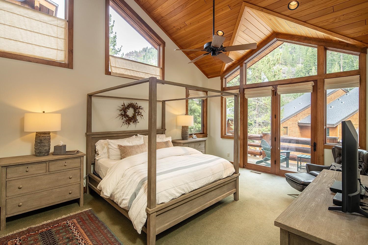 135 Alpine Meadows Road, Unit 33 Alpine Meadows, CA 96145 - Photo 8 of 21 a bedroom with a large bed and a flat tv screen on the dresser