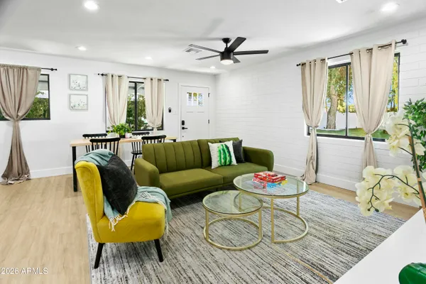 a living room with furniture and a table