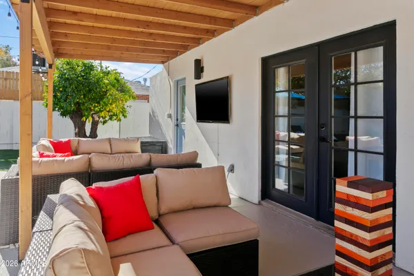 a living room with a couch and a flat screen tv