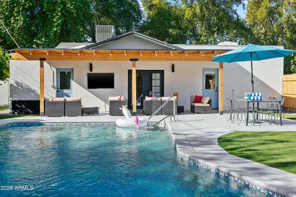 a view of a house with swimming pool