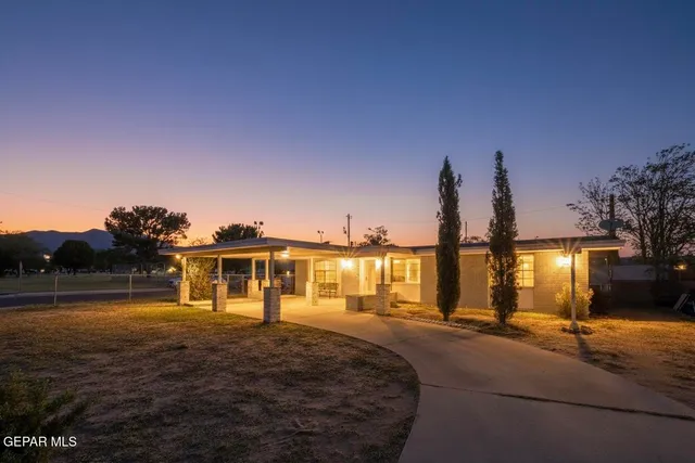 a front view of a house with a lake view