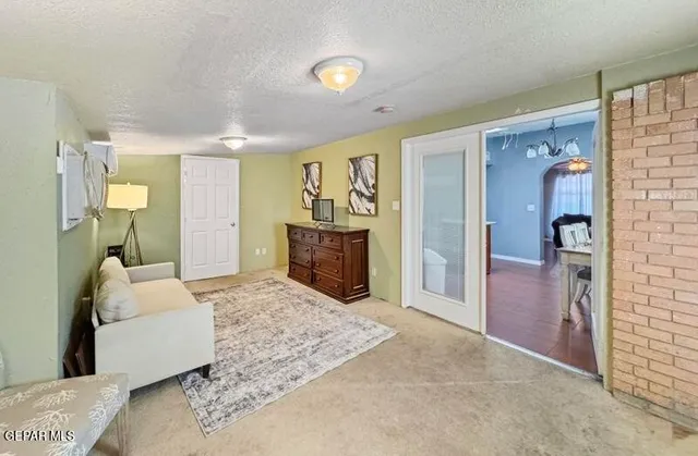 a bedroom with a bed and a couch