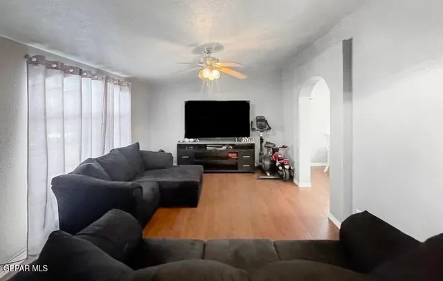 a living room with furniture and a flat screen tv