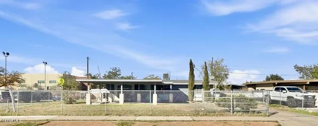 a view of a swimming pool with a yard