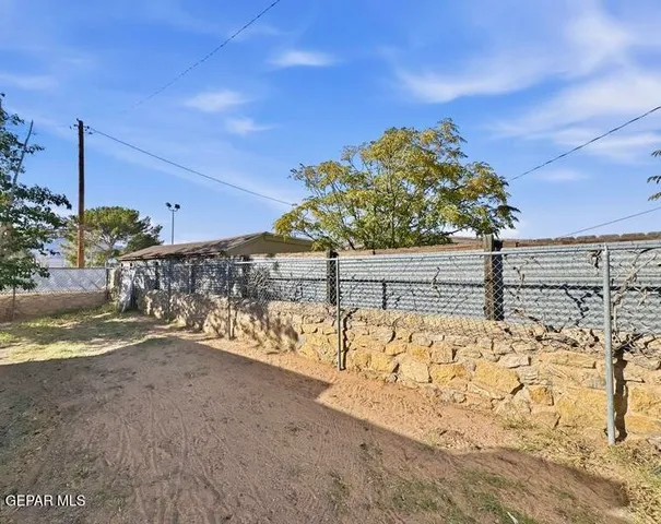 a view of a road with an trees in the background