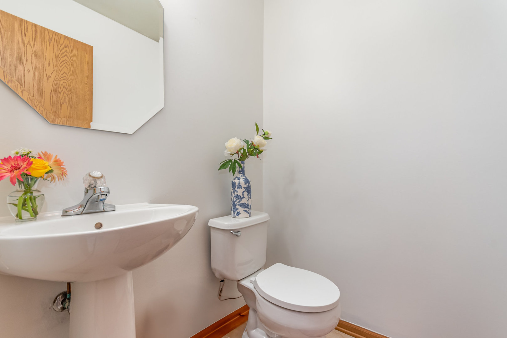 16043 Tiger Drive Lockport, IL 60441 - Photo 11 of 22 a bathroom with a sink a toilet and a mirror