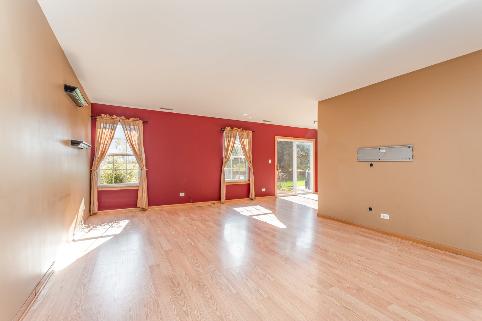 16043 Tiger Drive Lockport, IL 60441 - Photo 8 of 22 a view of an empty room with wooden floor and a window