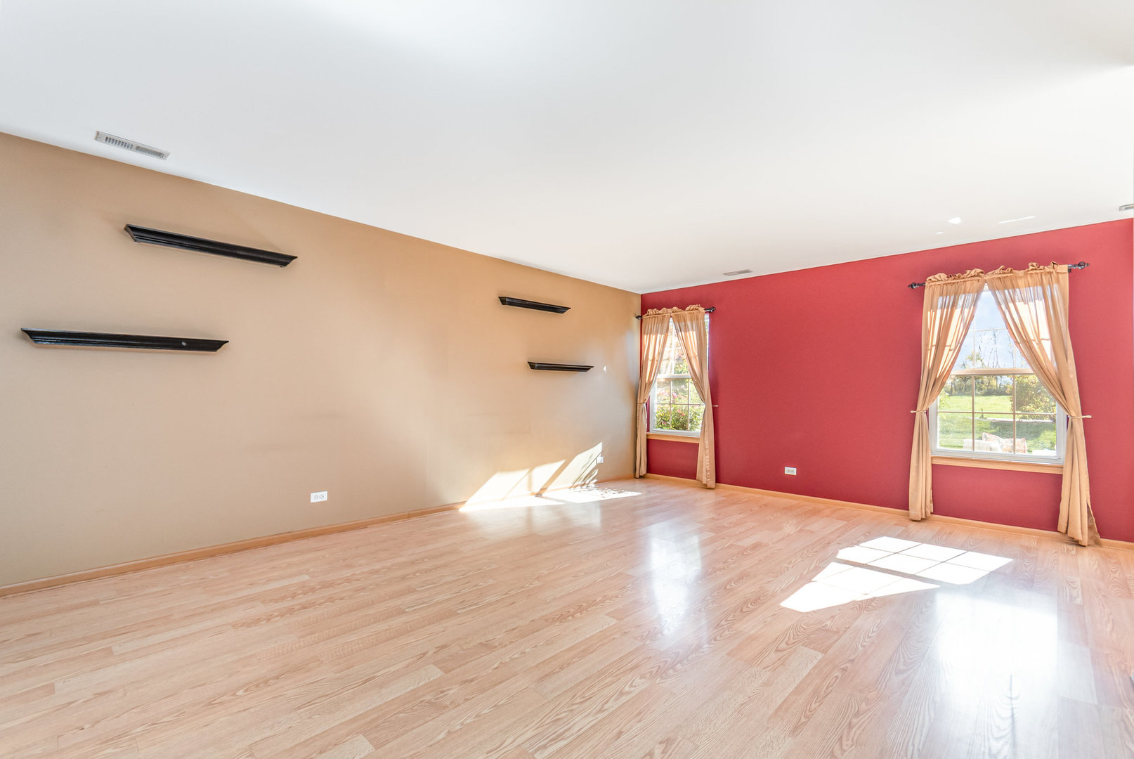 16043 Tiger Drive Lockport, IL 60441 - Photo 9 of 22 a view of empty room with wooden floor and fan