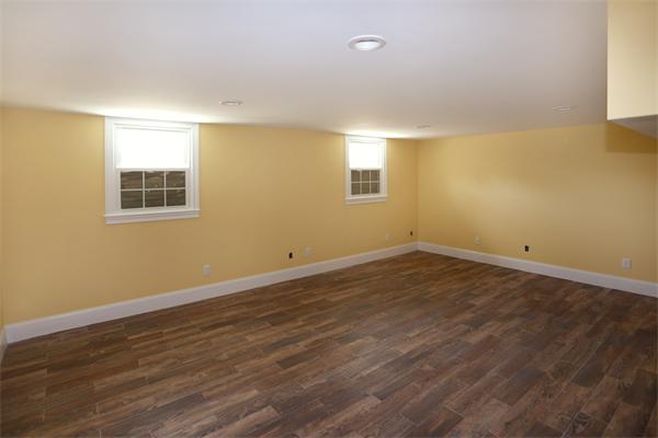 115 B Lakeshore Road Boxford, MA 01921 - Photo 18 of 21 a view of a room with wooden floor and windows