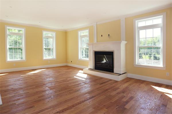115 B Lakeshore Road Boxford, MA 01921 - Photo 6 of 21 a view of an empty room with window and fire place
