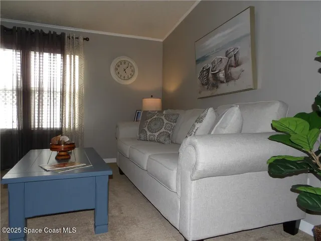 a living room with furniture and window