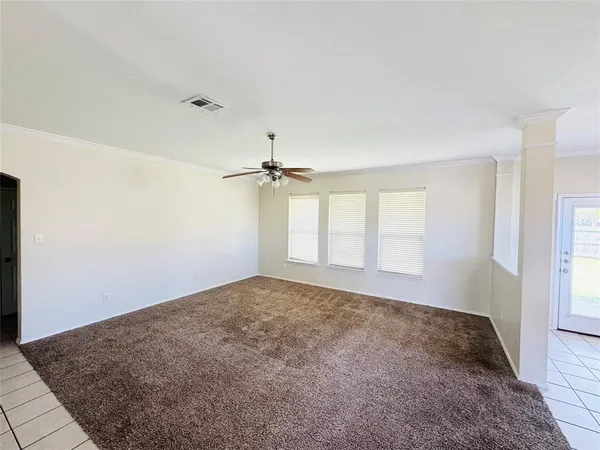 a living room with furniture and a counter top space