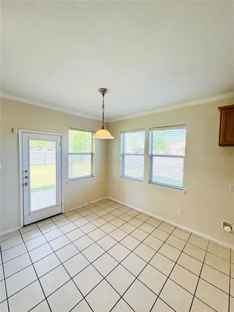 a view of wooden floor in an empty room