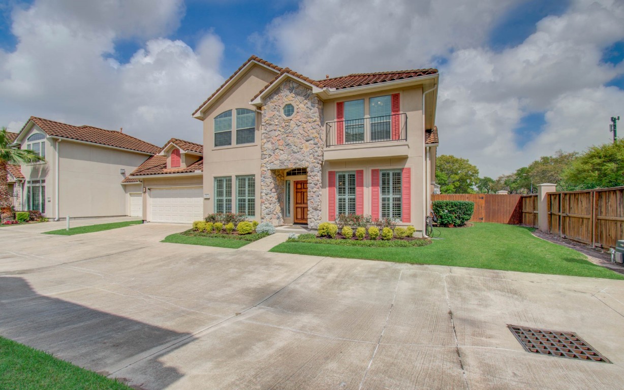 1463 Springrock Lane, Unit A Houston, TX 77055 - Photo 2 of 46 front view of a house with a yard