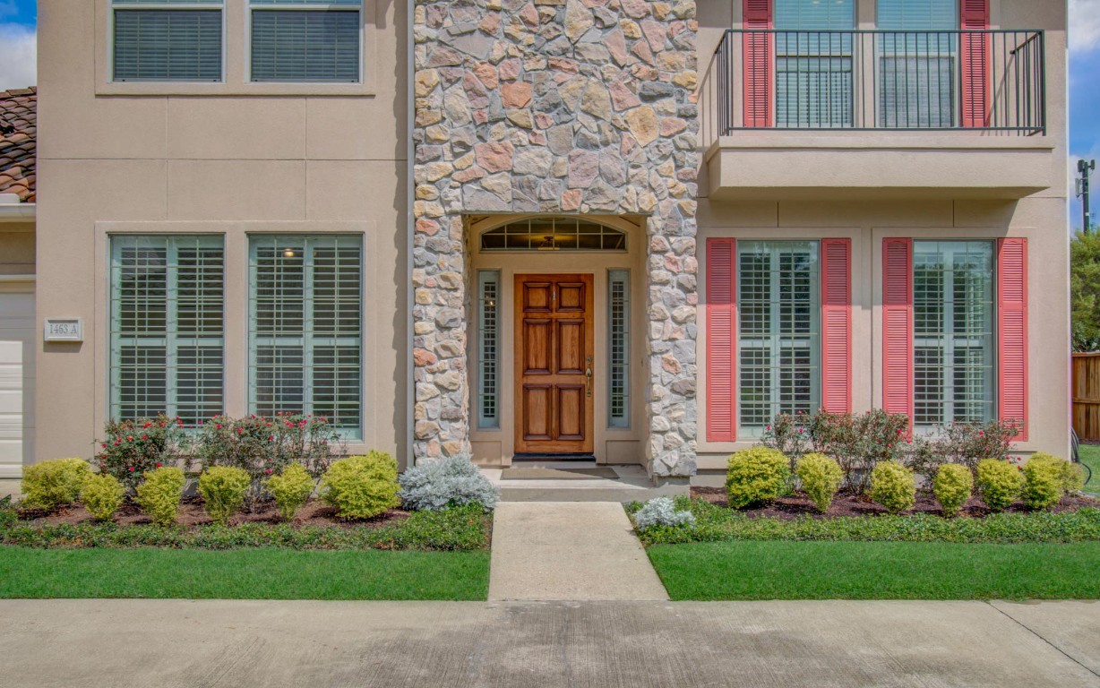 1463 Springrock Lane, Unit A Houston, TX 77055 - Photo 3 of 46 a view of a house with potted plants and a yard with potted plants