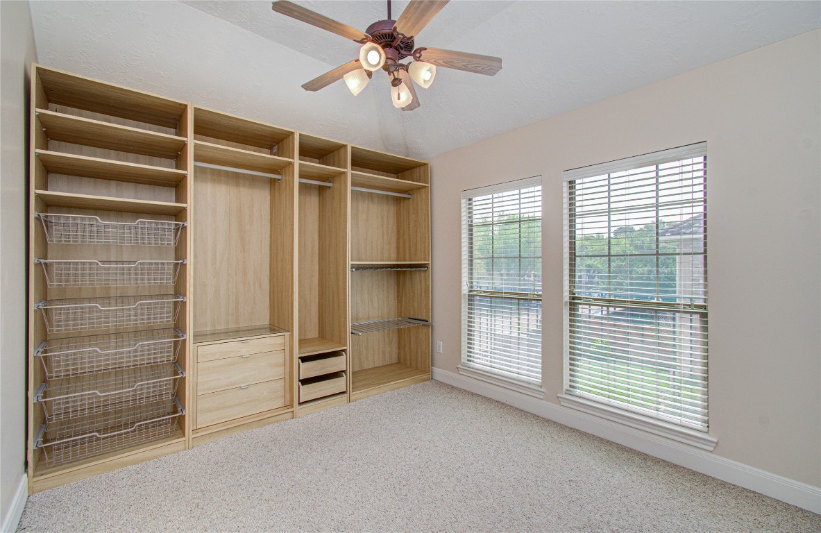 1463 Springrock Lane, Unit A Houston, TX 77055 - Photo 34 of 46 Bedroom #2 on the second floor features built-in storage for added functionality and organization.