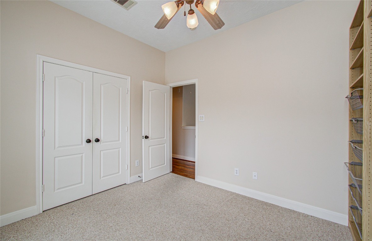 1463 Springrock Lane, Unit A Houston, TX 77055 - Photo 35 of 46 a view of an empty room and chandelier fan