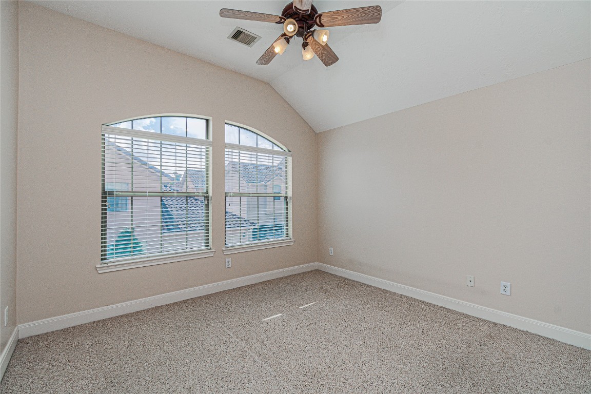 1463 Springrock Lane, Unit A Houston, TX 77055 - Photo 36 of 46 an empty room with a window