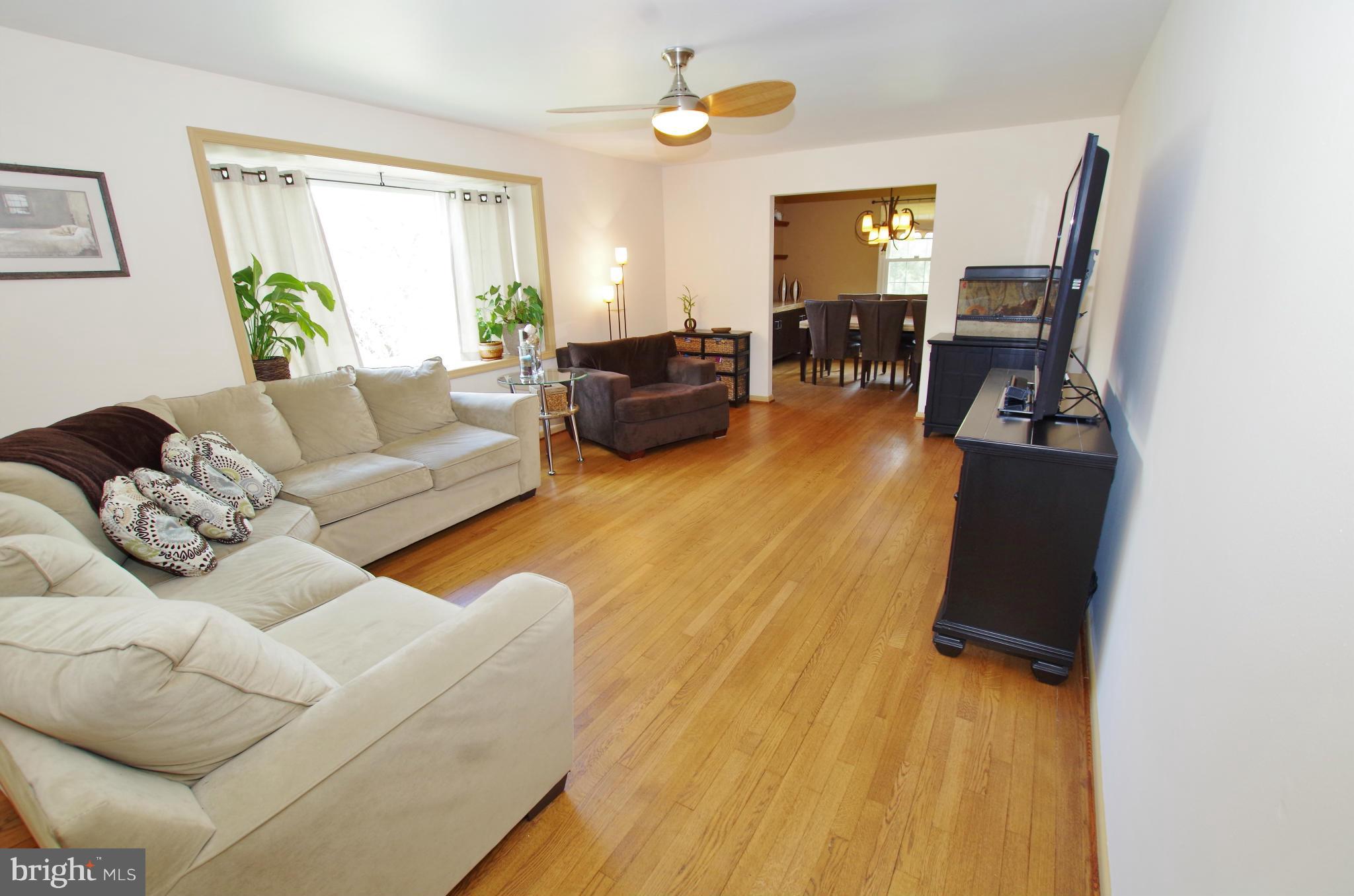 Spacious Living Room with Hardwood Floors