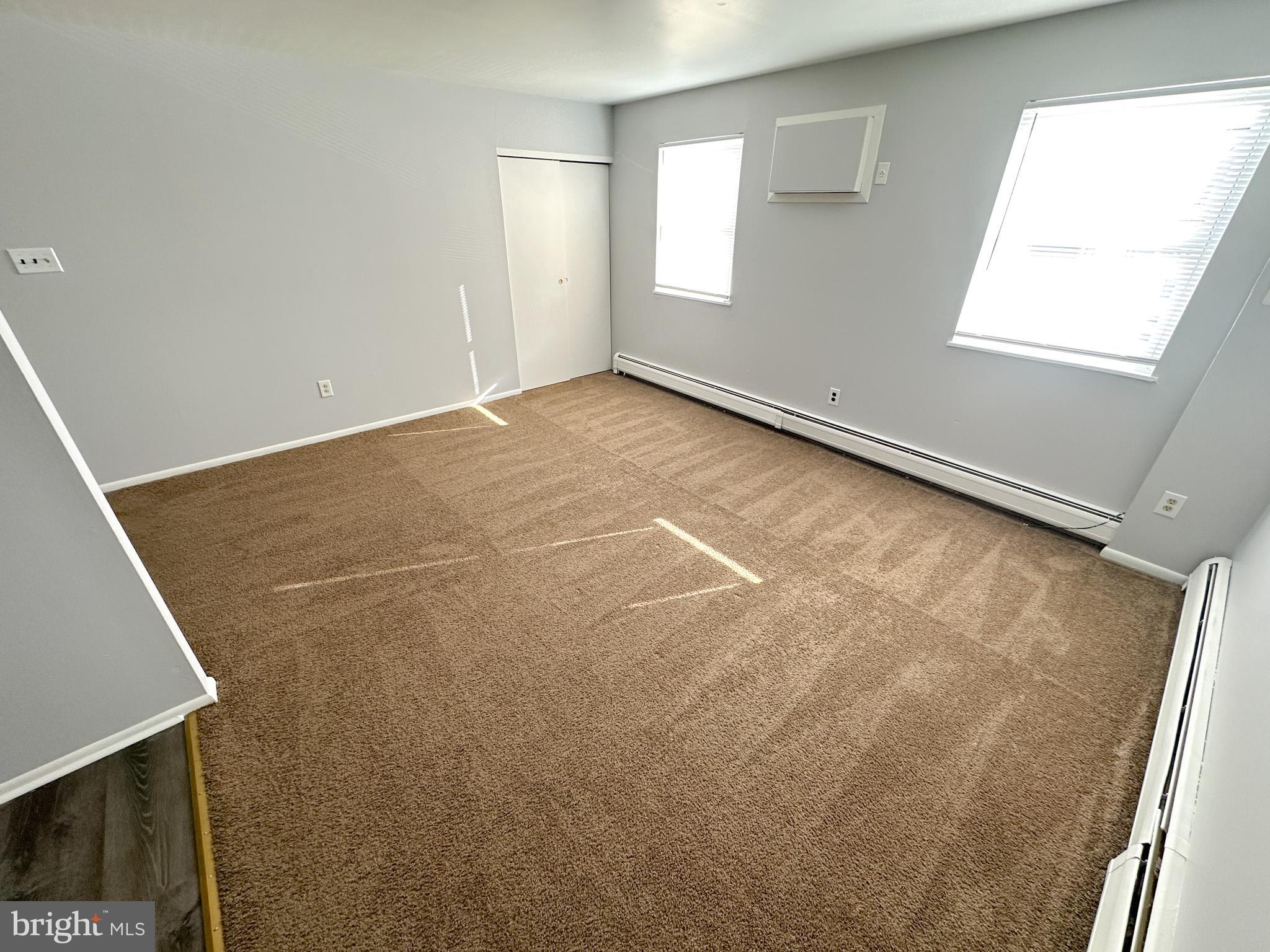 6022 Hegerman Street, Unit 2 Philadelphia, PA 19135 - Photo 3 of 11 an empty room with windows