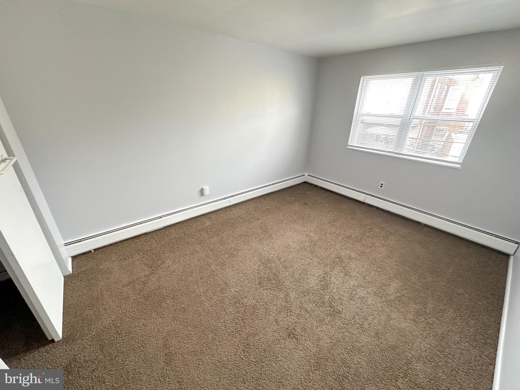 6022 Hegerman Street, Unit 2 Philadelphia, PA 19135 - Photo 6 of 11 an empty room with a window