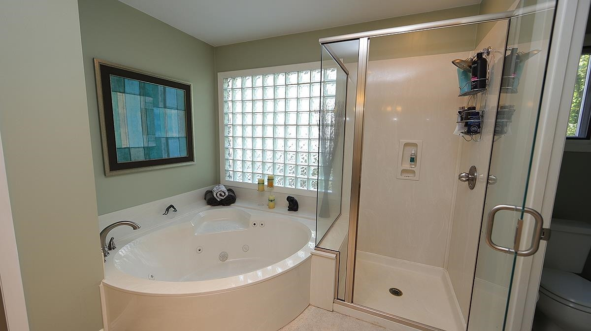 4005 Lake Springs Court Raleigh, NC 27613 - Photo 24 of 38 features a garden tub and separate shower Owners bath/suite
