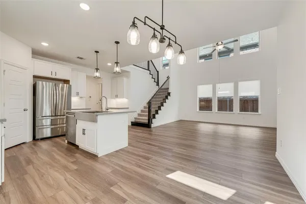 a view of kitchen with furniture and wooden floor
